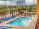 A pool with a water park is surrounded by a deck with lounge chairs at 7000 N Ocean Blvd. # 427, Myrtle Beach, SC 29572