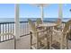 Balcony featuring a dining table with seating and an ocean view at 703 S Waccamaw Dr., Garden City Beach, SC 29576
