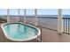 Relaxing balcony features a private dipping pool with ocean views, offering the perfect coastal escape at 703 S Waccamaw Dr., Garden City Beach, SC 29576