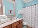 Well-appointed bathroom with a stylish vanity, and shower, perfect for relaxation and functionality at 703 S Waccamaw Dr., Garden City Beach, SC 29576