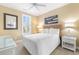 Comfortable bedroom with a bed, coastal decor, and lots of natural light at 703 S Waccamaw Dr., Garden City Beach, SC 29576