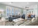 Spacious living room boasting plenty of natural light, comfortable seating, and stylish décor at 703 S Waccamaw Dr., Garden City Beach, SC 29576