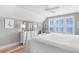 Bright main bedroom featuring a king bed, dresser and natural light, with coastal decor at 703 S Waccamaw Dr., Garden City Beach, SC 29576