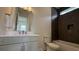 Bathroom featuring a vanity, toilet, a shower and tub with tile surround at 7040 Belancino Blvd., Myrtle Beach, SC 29572