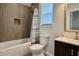 Bathroom with tub, shower with curtain, tiled walls, and vanity with sink and mirror at 7040 Belancino Blvd., Myrtle Beach, SC 29572