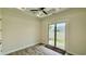 Bedroom featuring a sliding door, patio access, and tile floors at 7040 Belancino Blvd., Myrtle Beach, SC 29572