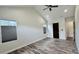 Bedroom featuring a sliding barn door, tile floors, and ample natural light at 7040 Belancino Blvd., Myrtle Beach, SC 29572