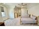 Bright bedroom featuring twin beds, wood floors, ceiling fan, and ample natural light at 7040 Belancino Blvd., Myrtle Beach, SC 29572