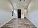 Bedroom featuring a sliding barn door, tile floors, and ample natural light at 7040 Belancino Blvd., Myrtle Beach, SC 29572