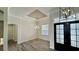 Dining room featuring elegant lighting, a window, and view of the front door at 7040 Belancino Blvd., Myrtle Beach, SC 29572