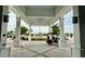 View of a golf cart at the entrance with white pillars, concrete floor and view of the community at 7040 Belancino Blvd., Myrtle Beach, SC 29572