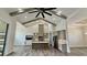 Modern kitchen with high ceiling, ceiling fan, kitchen island, and gray cabinetry at 7040 Belancino Blvd., Myrtle Beach, SC 29572