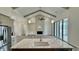Spacious living room with a white brick fireplace, recessed lighting, and a kitchen island at 7040 Belancino Blvd., Myrtle Beach, SC 29572