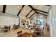 Spacious lounge area with wood tables, a stone fireplace, and comfortable seating at 7040 Belancino Blvd., Myrtle Beach, SC 29572
