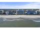 Beautiful aerial view of a beachfront resort with ocean views and sandy beach at 7100 N Ocean Blvd. # 204, Myrtle Beach, SC 29572