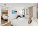 Comfortable bedroom with a plush bed, wall-mounted TV, and mirrored closet at 7100 N Ocean Blvd. N # 321, Myrtle Beach, SC 29572