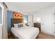 Comfortable bedroom with a large bed and beach-themed art at 7100 N Ocean Blvd. N # 321, Myrtle Beach, SC 29572