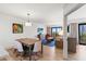 Bright dining area next to the living room with balcony access at 7100 N Ocean Blvd. N # 321, Myrtle Beach, SC 29572