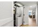 Convenient laundry closet with a stacked washer and dryer unit and storage at 7100 N Ocean Blvd. N # 321, Myrtle Beach, SC 29572