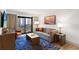 Comfortable living room with a modern sofa and balcony access at 7100 N Ocean Blvd. N # 321, Myrtle Beach, SC 29572