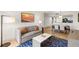 Well-lit living room with a modern sofa and open dining area at 7100 N Ocean Blvd. N # 321, Myrtle Beach, SC 29572
