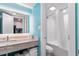 Stylish bathroom featuring a marble countertop sink and tub shower with white tile at 7200 N Ocean Blvd. # 360, Myrtle Beach, SC 29572