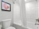 Bright bathroom features white subway tile, modern fixtures and a tub with shower at 7200 N Ocean Blvd. # 360, Myrtle Beach, SC 29572