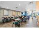 Large dining area featuring modern furnishings, brick walls and a glimpse of the ocean at 7200 N Ocean Blvd. # 360, Myrtle Beach, SC 29572