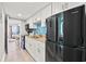 Modern kitchen with stainless steel appliances and elegant backsplash, flowing into dining area at 7200 N Ocean Blvd. # 360, Myrtle Beach, SC 29572