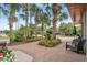 Well-manicured landscaping with vibrant flowers and lush palm trees on a brick walkway at 7200 N Ocean Blvd. # 360, Myrtle Beach, SC 29572