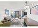 Bright, modern living room area with sofa, dining table, and balcony access with ocean views at 7200 N Ocean Blvd. # 360, Myrtle Beach, SC 29572