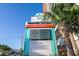 Grande Cayman Resort signage, turtle logo, digital display, and tropical plants at 7200 N Ocean Blvd. # 360, Myrtle Beach, SC 29572