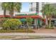 Exterior view of Starbucks with outdoor seating surrounded by tropical landscaping at 7200 N Ocean Blvd. # 360, Myrtle Beach, SC 29572