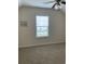 The bedroom has a ceiling fan, a large window with blinds, and neutral carpet at 739 Shell Creek Circle # 739, North Myrtle Beach, SC 29582