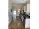 Well-equipped kitchen with stainless steel appliances, dark countertops, and tile flooring at 739 Shell Creek Circle # 739, North Myrtle Beach, SC 29582