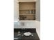 Pantry with serving ware and decorative elements; kitchen area with stainless appliances and dark counters at 739 Shell Creek Circle # 739, North Myrtle Beach, SC 29582