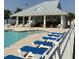 Community pool area with lounge chairs and covered clubhouse at 739 Shell Creek Circle # 739, North Myrtle Beach, SC 29582