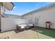 Private patio with seating area, a grill, brick pavers, artificial turf, and white fence for a relaxing outdoor space at 750 Howard Ave. # C, Myrtle Beach, SC 29577