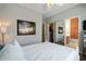 Bright bedroom showcasing closet with mirrored doors and en suite bathroom at 750 Howard Ave. # C, Myrtle Beach, SC 29577