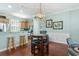 Charming dining area with modern lighting, hardwood floors, and convenient access to the kitchen at 750 Howard Ave. # C, Myrtle Beach, SC 29577