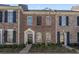 Charming brick townhome with black shutters, neat landscaping, and inviting front entrance at 750 Howard Ave. # C, Myrtle Beach, SC 29577