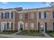 Charming brick townhome featuring classic architectural details, a well-manicured landscape, and inviting front entrance at 750 Howard Ave. # C, Myrtle Beach, SC 29577