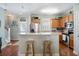 Well-lit kitchen featuring a breakfast bar and stainless steel appliances at 750 Howard Ave. # C, Myrtle Beach, SC 29577