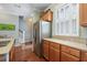 Bright kitchen with stainless steel refrigerator, granite countertops, cabinets, and wood flooring at 750 Howard Ave. # C, Myrtle Beach, SC 29577