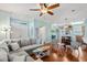 Open living space with a gray sofa, access to the kitchen, and hardwood flooring at 750 Howard Ave. # C, Myrtle Beach, SC 29577