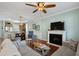 Cozy living room showcasing a fireplace, comfortable seating, and a seamless connection to the kitchen at 750 Howard Ave. # C, Myrtle Beach, SC 29577