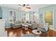 Stylish living area with coastal decor, hardwood floors, and comfortable seating; bathroom access at 750 Howard Ave. # C, Myrtle Beach, SC 29577
