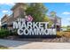 The Market Common signage with palm trees against a clear blue sky on a sunny day at 750 Howard Ave. # C, Myrtle Beach, SC 29577