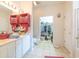 A well-lit bathroom featuring a vanity, toilet, and walk-in closet at 750 Pinehurst Ln. # 84A, Pawleys Island, SC 29585