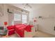 A bright bedroom with a white bed frame and red accents at 750 Pinehurst Ln. # 84A, Pawleys Island, SC 29585